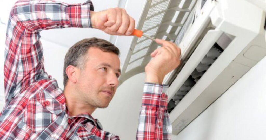 Los Angeles home emergency HVAC technician fixing AC unit 1